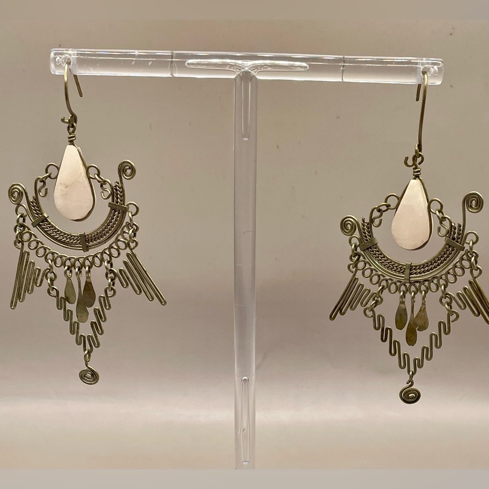 Vintage boho earrings w/silver scroll work and center pink two sided stone.